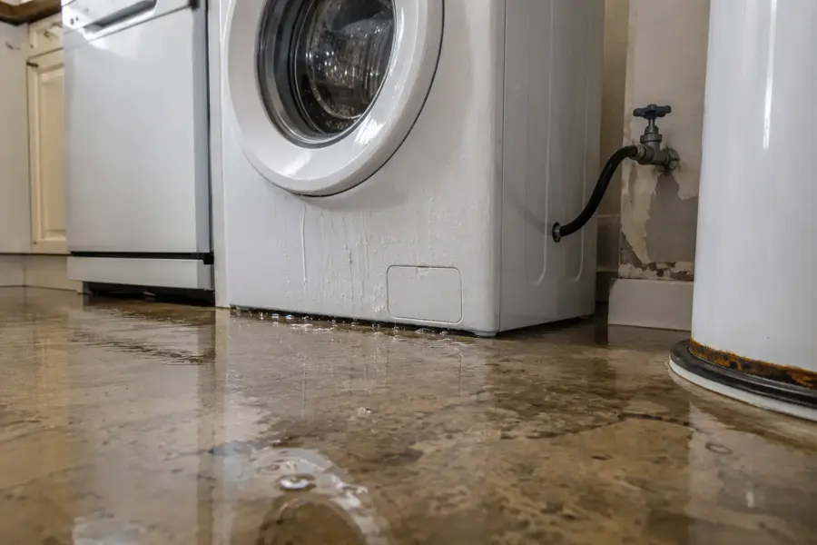 Appliance supply line leak flooding a Marietta, GA laundry room