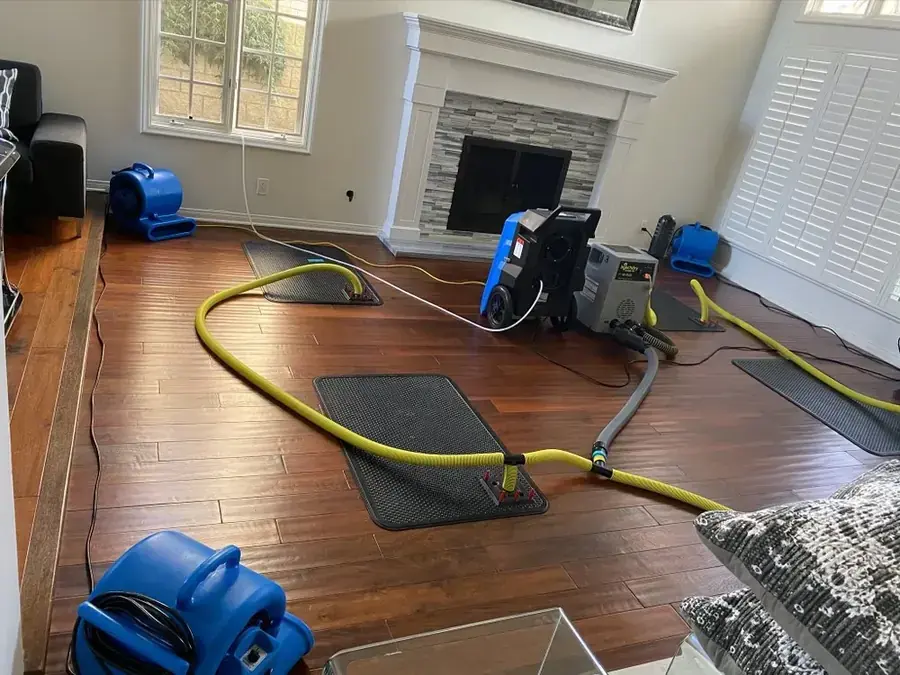 Air movers and dehumidifiers drying a room in a Marietta, GA home
